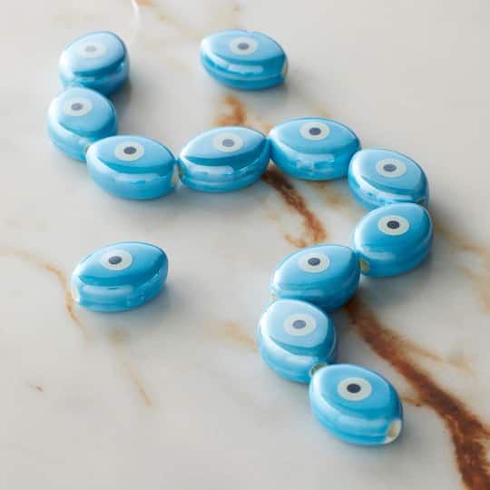 12 Packs: 12 ct. (144 total) Blue Ceramic Evil Eye Beads, 15.5mm by Bead Landing™